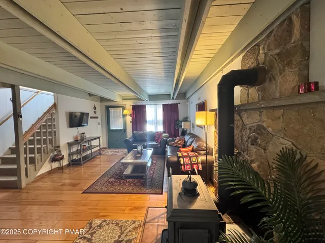 a view of living room with furniture and floor to ceiling window