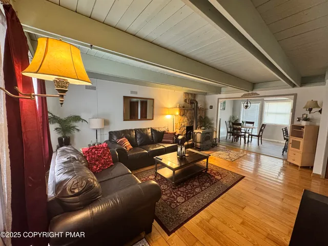 a living room with furniture and a table