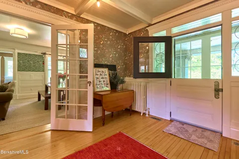 a view of an empty room with a fireplace