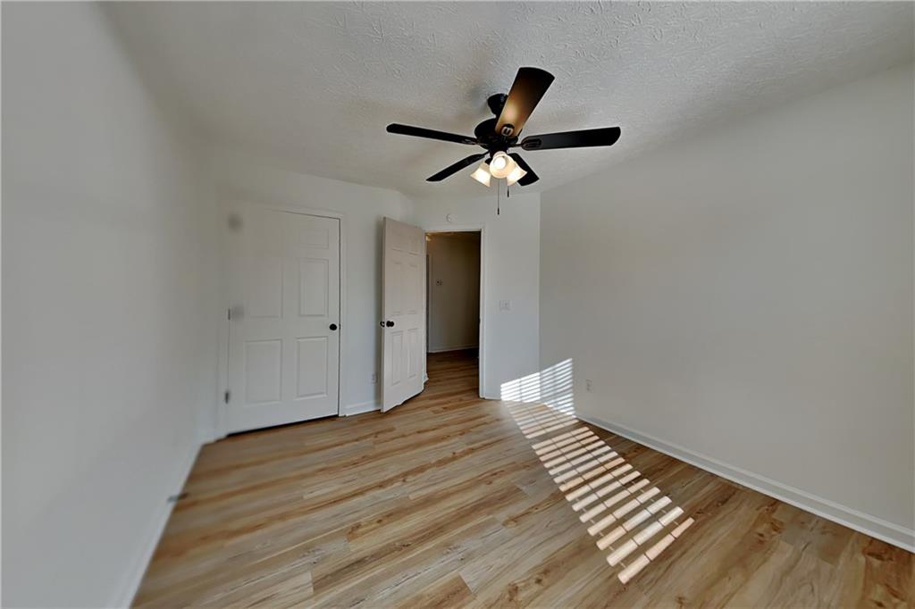 3616 Hollyhock Way Northwest Kennesaw, GA 30152 - Photo 13 of 18 a view of empty room with wooden floor