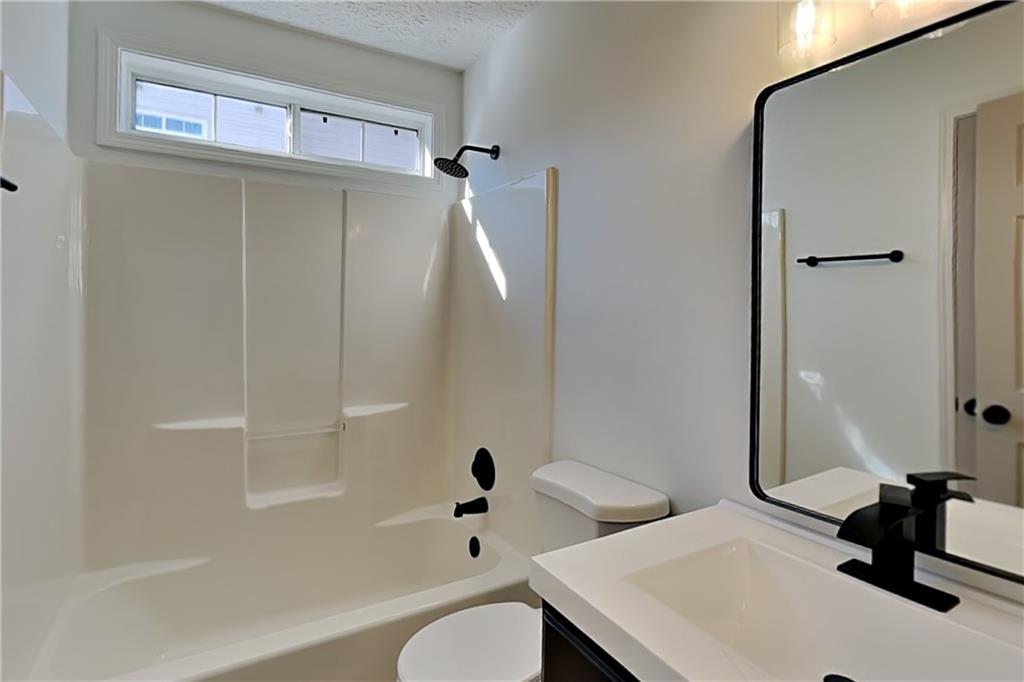 3616 Hollyhock Way Northwest Kennesaw, GA 30152 - Photo 15 of 18 a bathroom with a sink toilet and shower