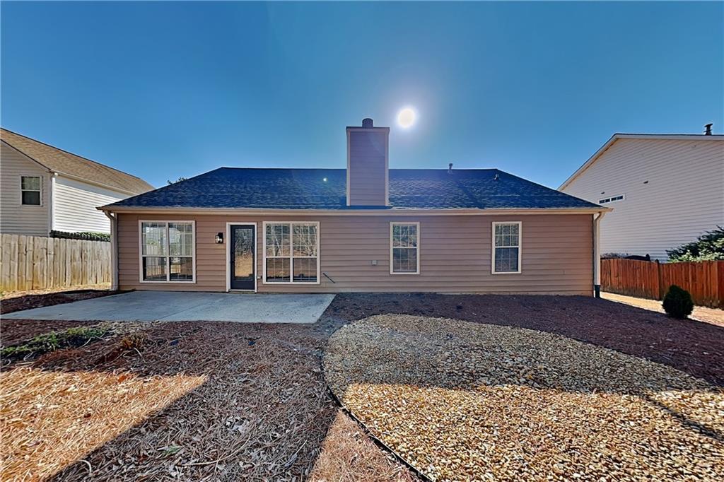 3616 Hollyhock Way Northwest Kennesaw, GA 30152 - Photo 17 of 18 a front view of a house with a yard and garage