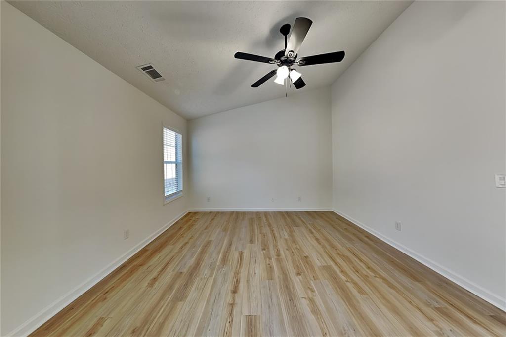 3616 Hollyhock Way Northwest Kennesaw, GA 30152 - Photo 7 of 18 wooden floor in an empty room with a window