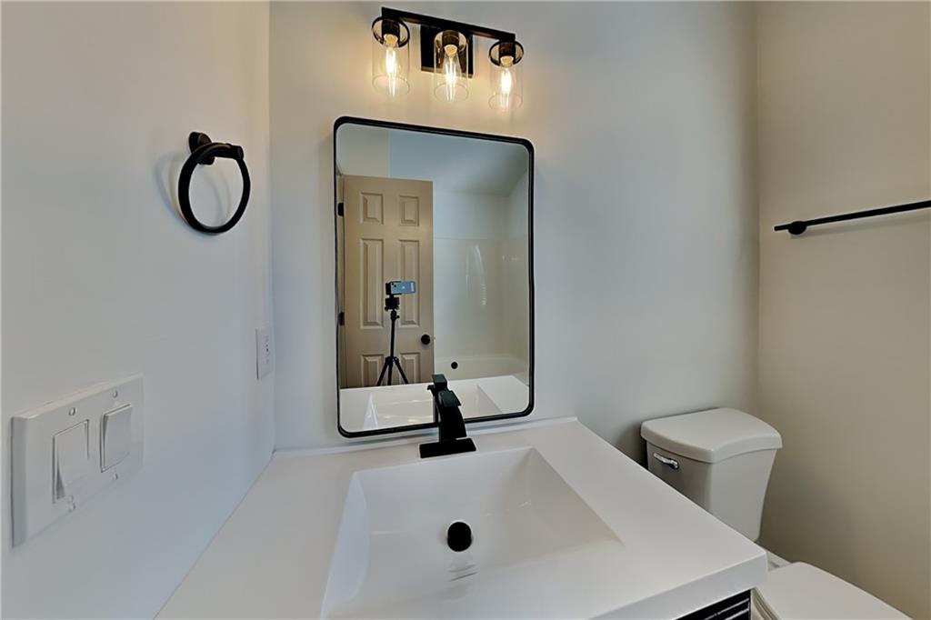 3616 Hollyhock Way Northwest Kennesaw, GA 30152 - Photo 8 of 18 a bathroom with a sink toilet and mirror
