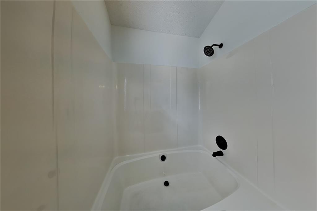 3616 Hollyhock Way Northwest Kennesaw, GA 30152 - Photo 9 of 18 a bathroom with a bathtub