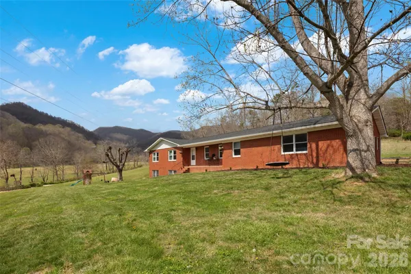 a view of a house with a big yard