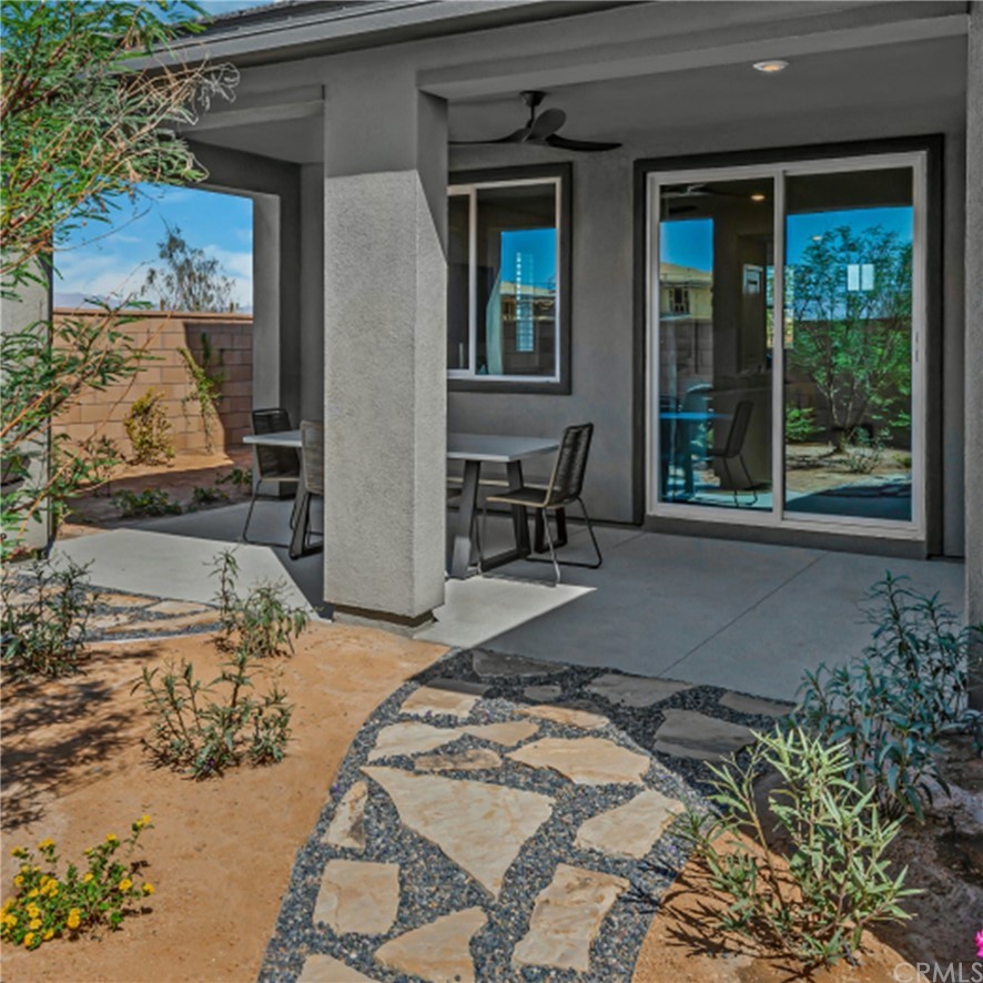 41114 Harvey Mudd Drive Palm Desert, CA 92211 - Photo 7 of 10 a backyard of a house with outdoor seating