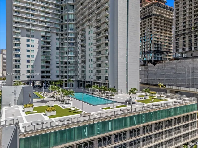 a view of swimming pool with outdoor seating