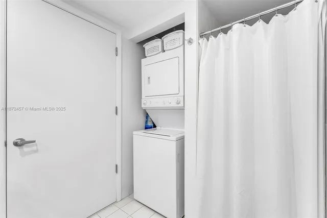 a bathroom with a shower curtain and a sink