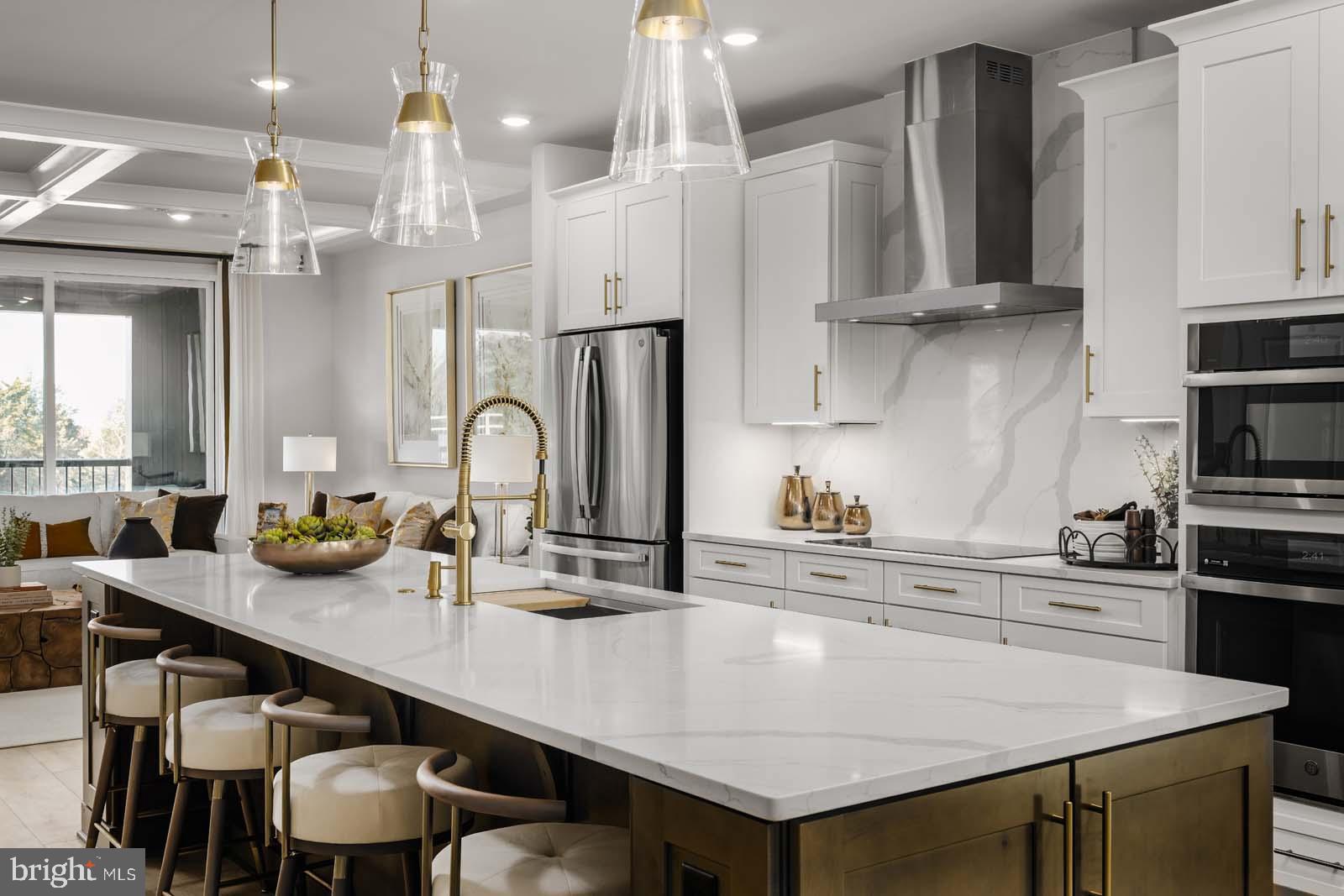 21787 Express Terrace, Unit 1128A Ashburn, VA 20147 - Photo 6 of 20 a kitchen with kitchen island granite countertop a table chairs sink and cabinets