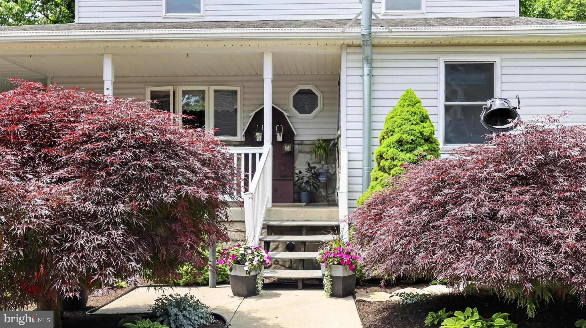 257 Hill Road New Holland, PA 17557 - Photo 31 of 94 Charming entrance with vibrant foliage.