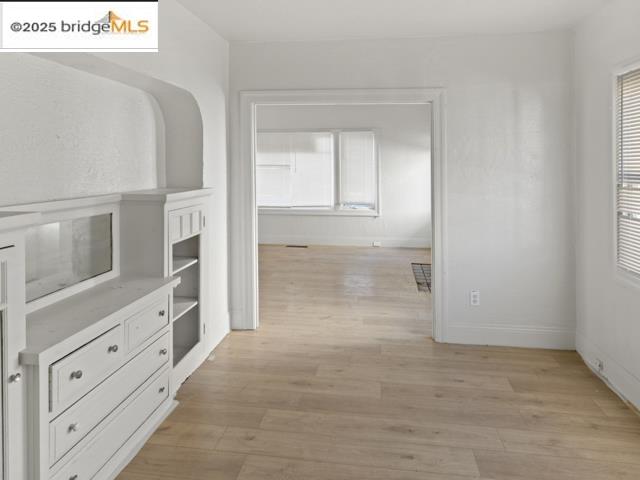 1556 78th Avenue Oakland, CA 94621 - Photo 2 of 11 view of an empty room with window and cabinet
