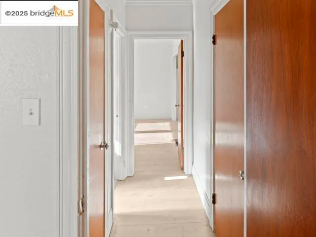 a view of a bathroom from a hallway