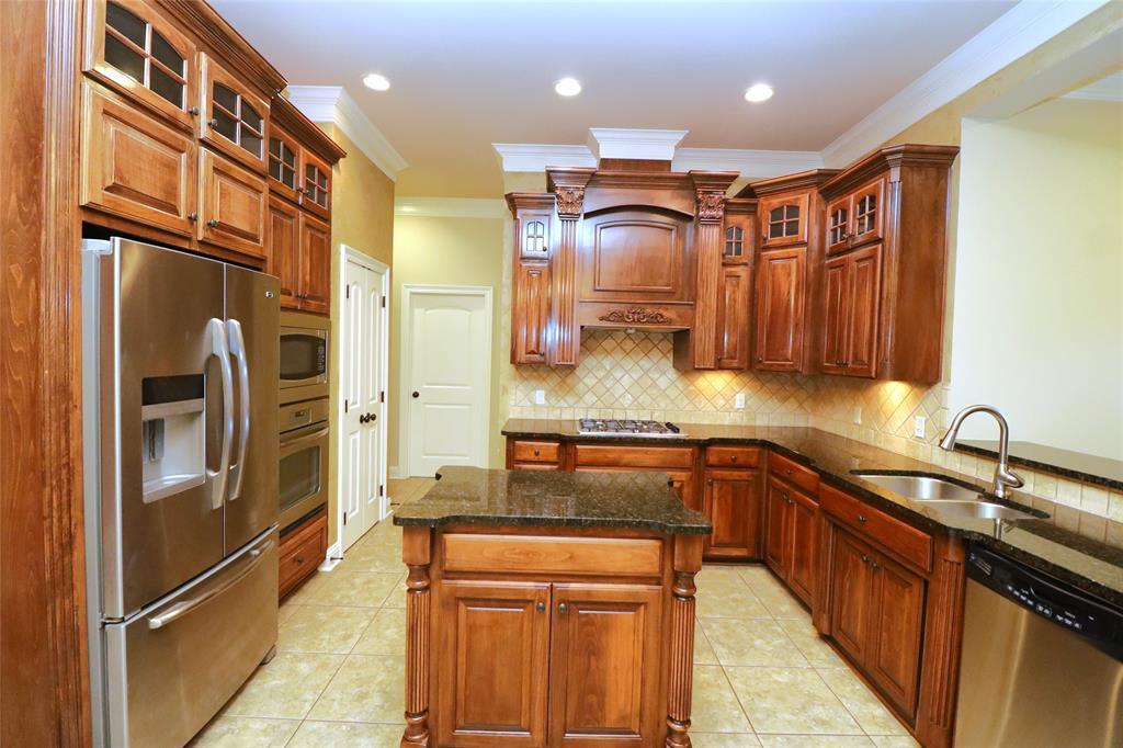 765 Dumaine Drive Bossier City, LA 71111 - Photo 11 of 20 a kitchen with stainless steel appliances granite countertop a sink and a refrigerator