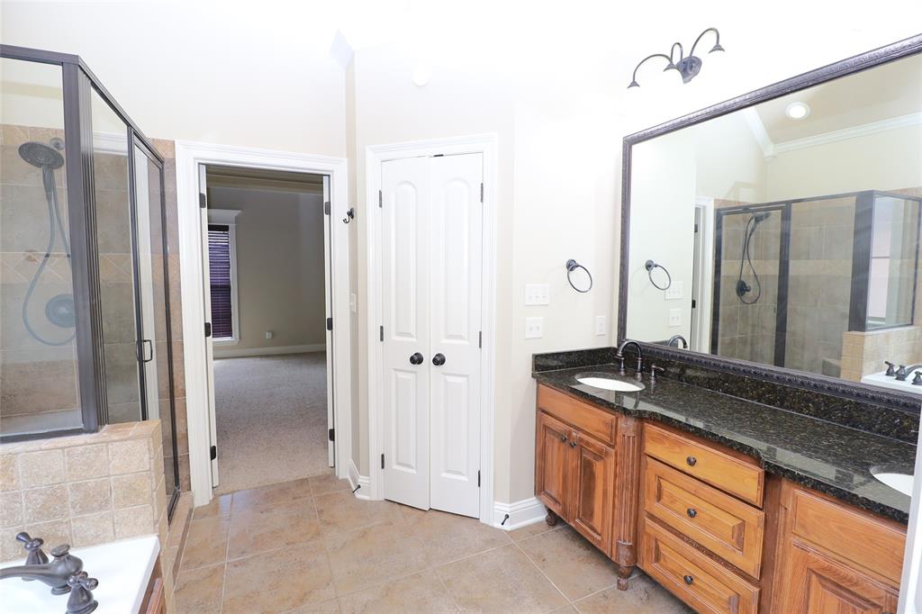 765 Dumaine Drive Bossier City, LA 71111 - Photo 14 of 20 a spacious bathroom with a granite countertop sink and a mirror