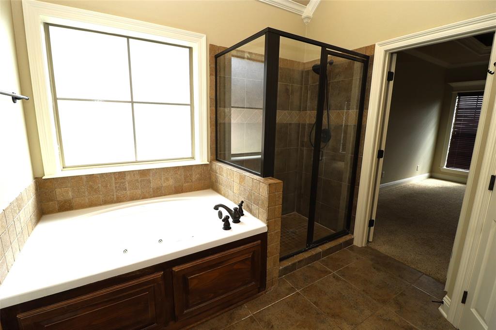 765 Dumaine Drive Bossier City, LA 71111 - Photo 15 of 20 a bathroom with a bathtub and a shower