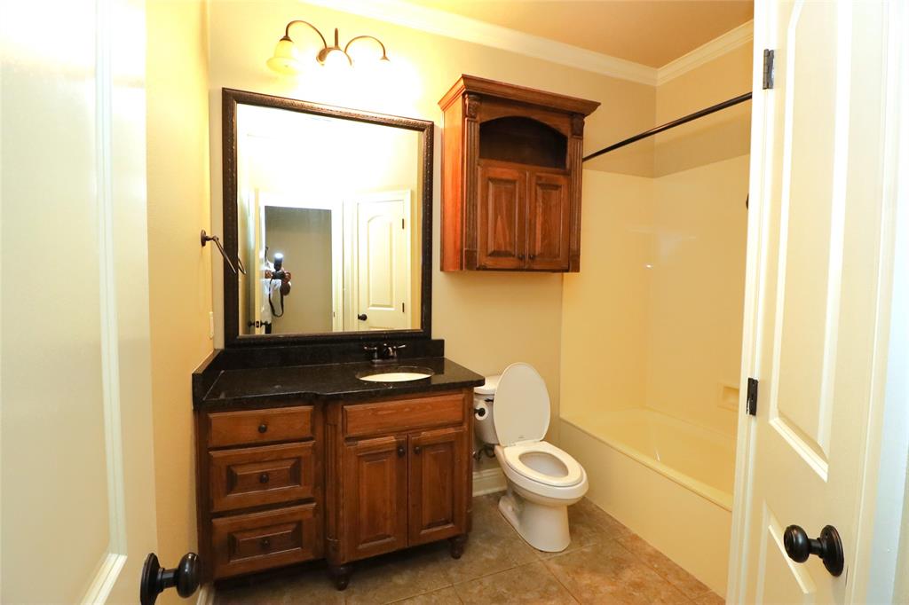 765 Dumaine Drive Bossier City, LA 71111 - Photo 18 of 20 a bathroom with a toilet a sink and a mirror