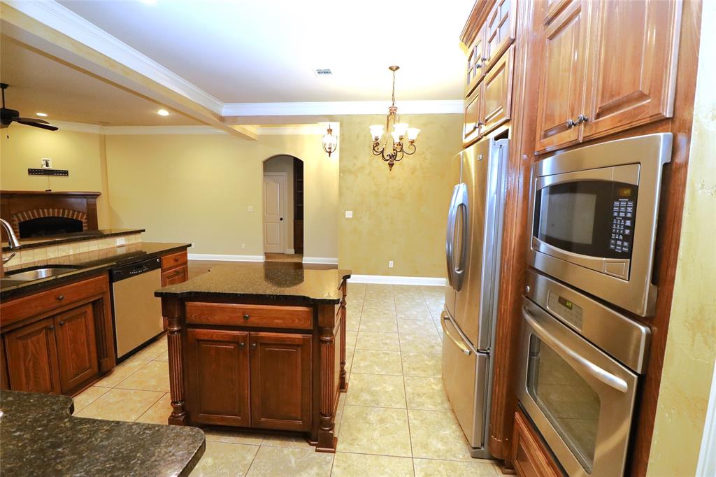 765 Dumaine Drive Bossier City, LA 71111 - Photo 10 of 20 a kitchen with a refrigerator and a sink