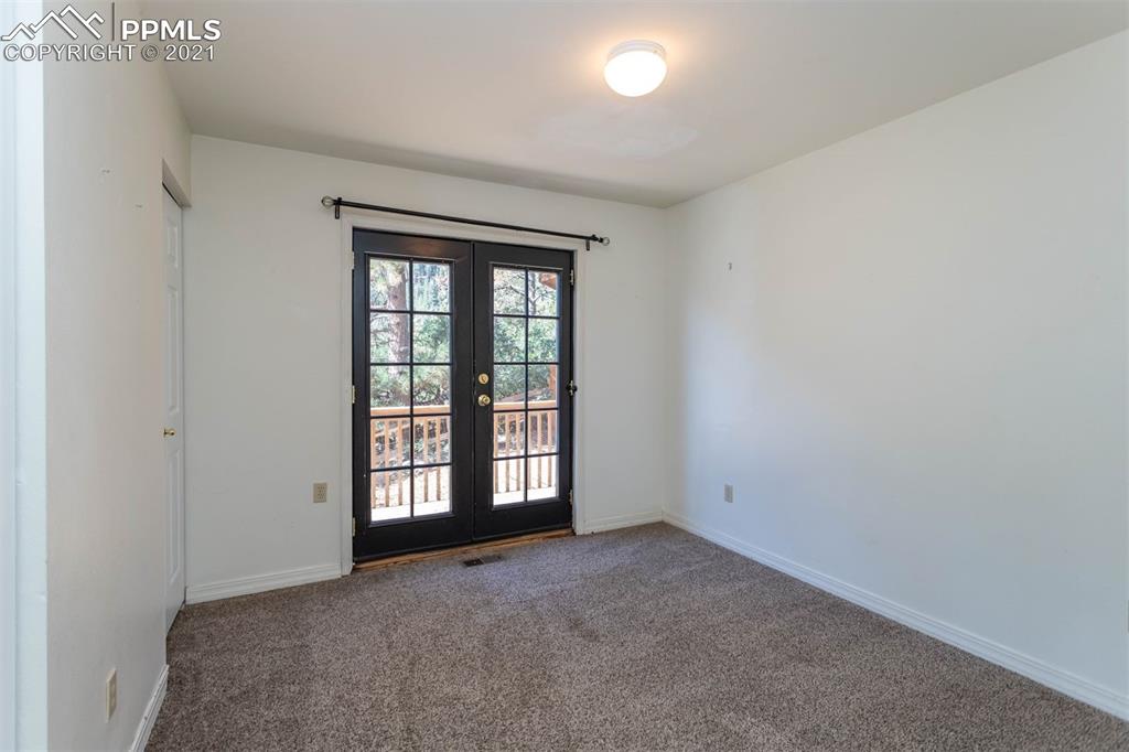 4440 Prairie Street Cascade, CO 80809 - Photo 2 of 38 an empty room with windows