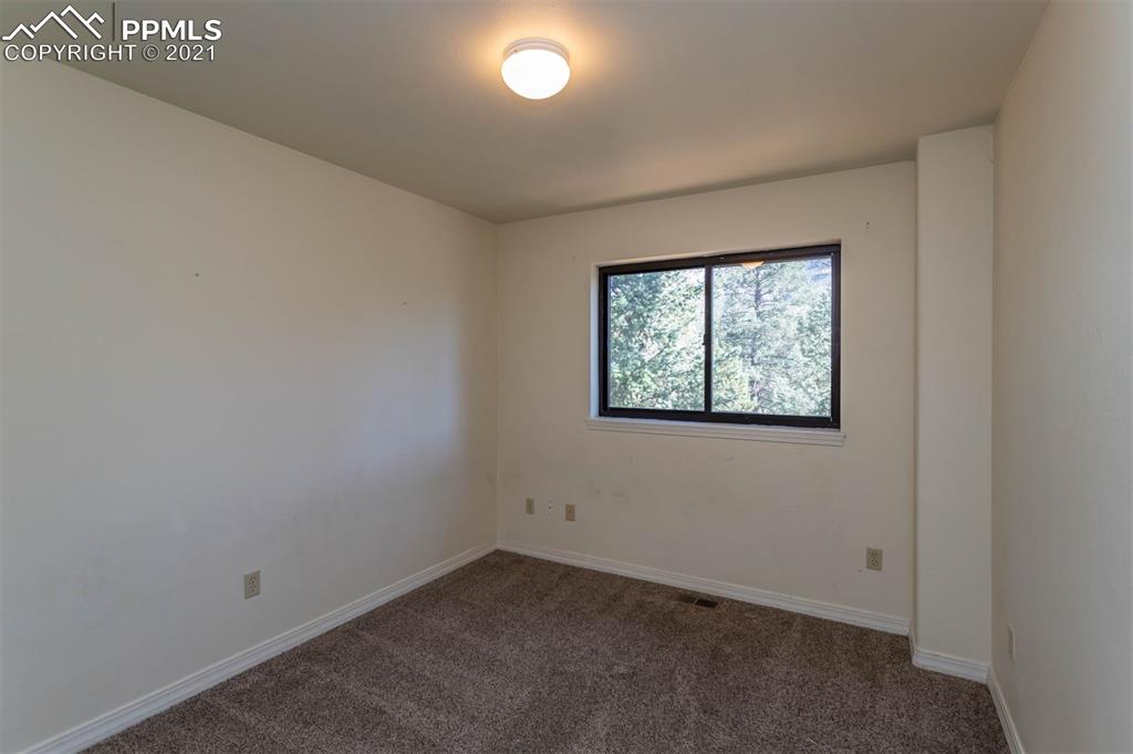 4440 Prairie Street Cascade, CO 80809 - Photo 15 of 38 an empty room with a window