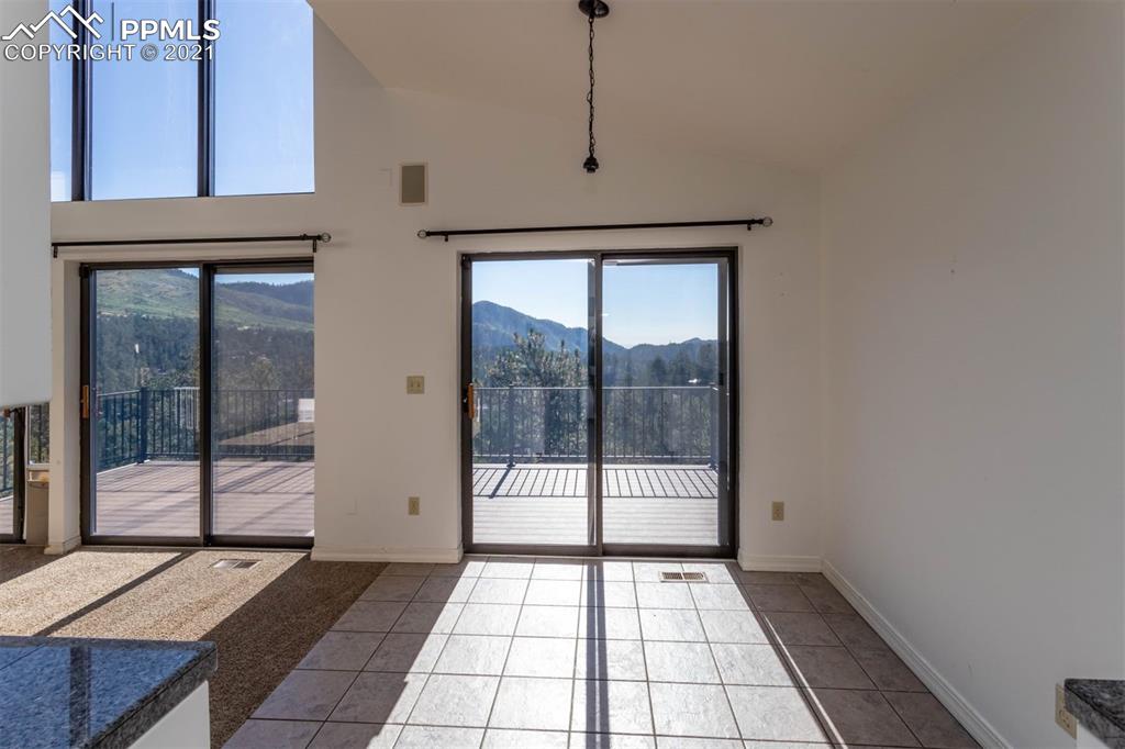4440 Prairie Street Cascade, CO 80809 - Photo 20 of 38 a view of an empty room with a window
