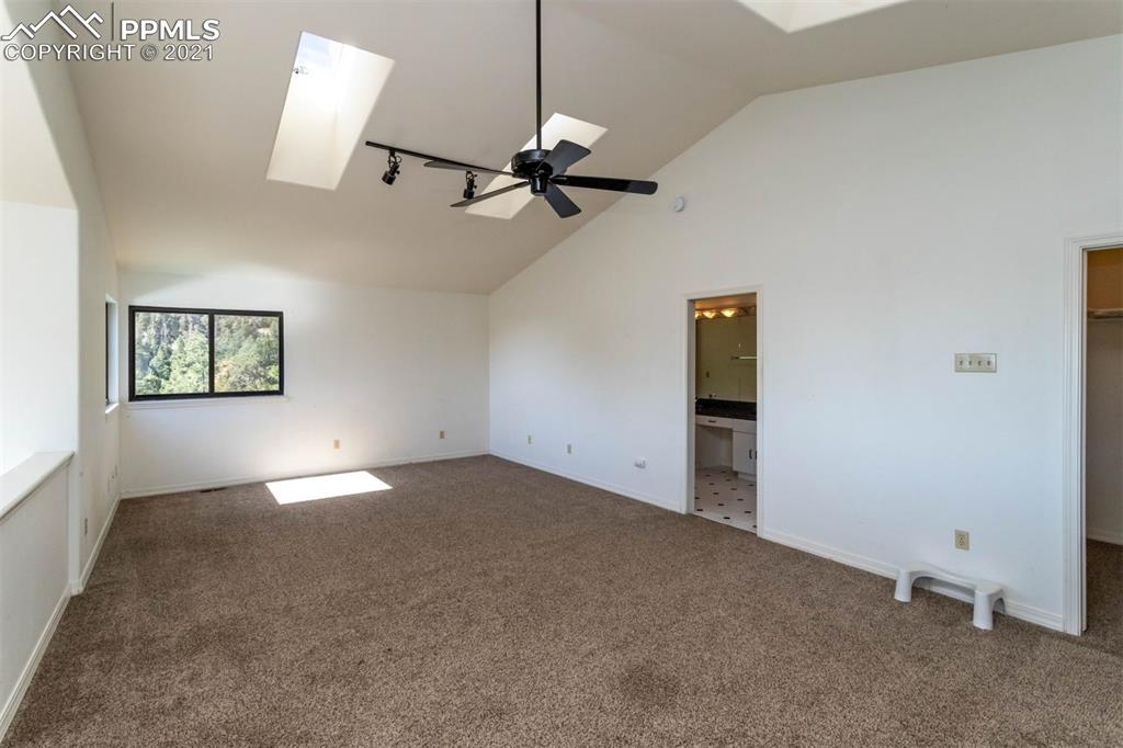 4440 Prairie Street Cascade, CO 80809 - Photo 32 of 38 a view of empty room with windows