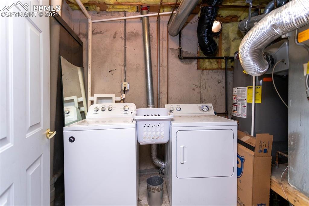 4440 Prairie Street Cascade, CO 80809 - Photo 34 of 38 a utility room with dryer and washer