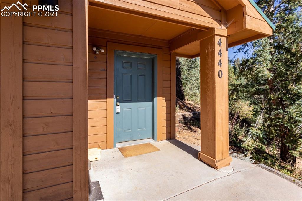 4440 Prairie Street Cascade, CO 80809 - Photo 36 of 38 a view of front door of house