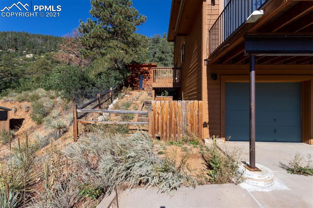 4440 Prairie Street Cascade, CO 80809 - Photo 37 of 38 a view of a house with a yard
