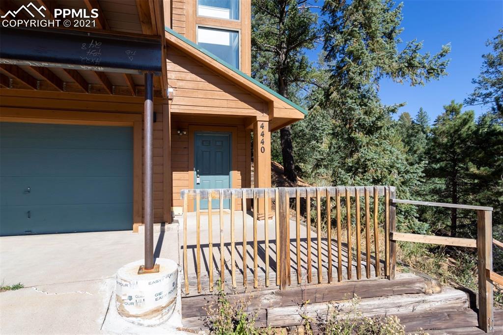 4440 Prairie Street Cascade, CO 80809 - Photo 38 of 38 a view of a wooden chairs and a table in the balcony