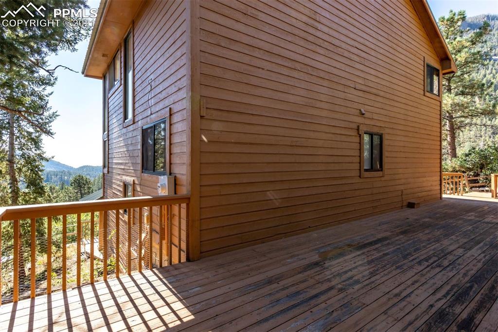4440 Prairie Street Cascade, CO 80809 - Photo 7 of 38 a view of a balcony with wooden floor