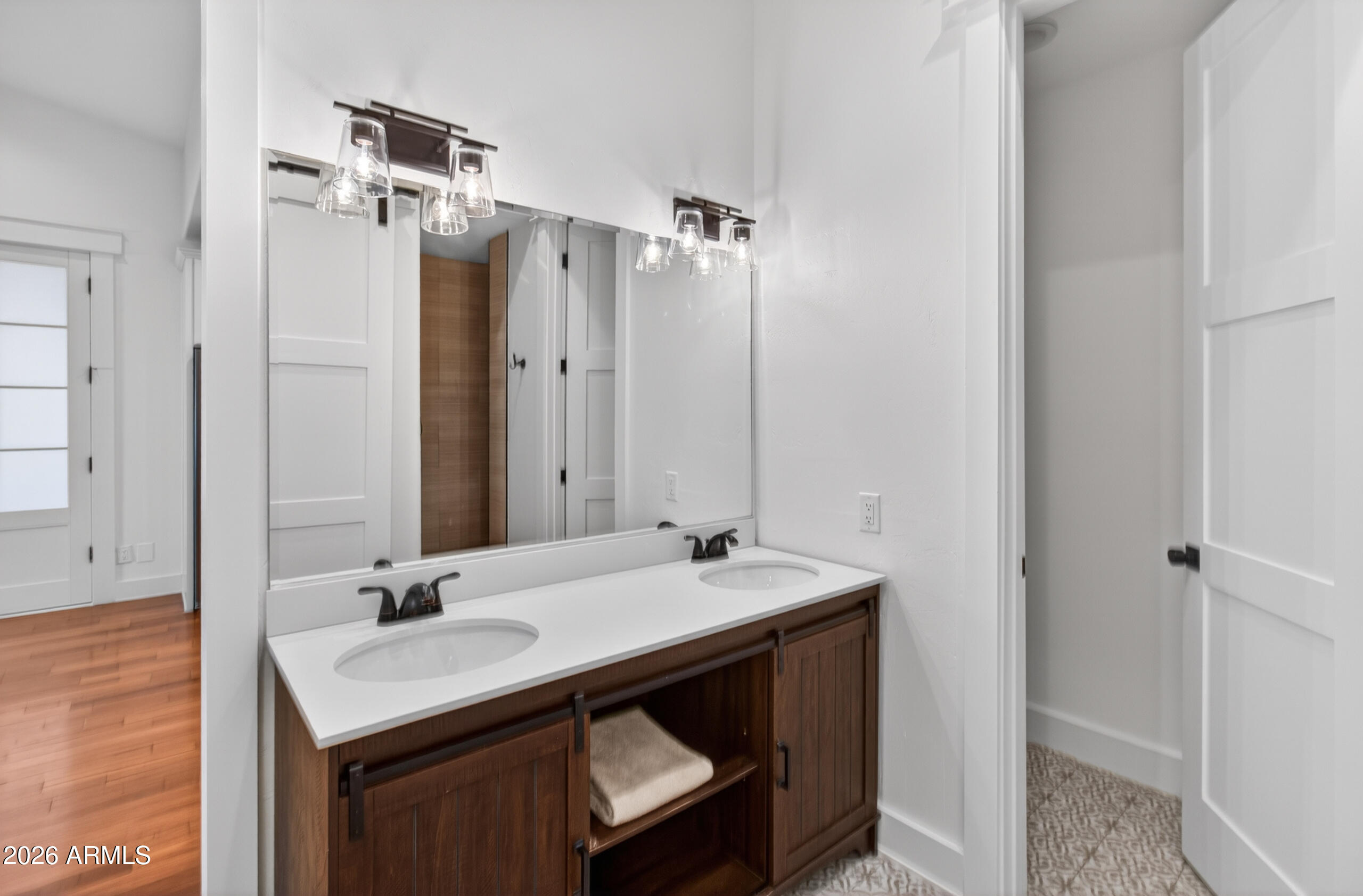 2677 East Queen Creek Road Gilbert, AZ 85297 - Photo 89 of 128 a bathroom with a sink double vanity and a mirror