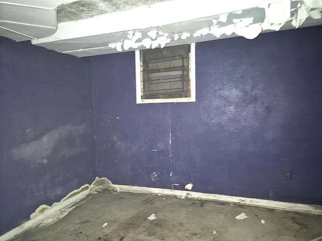 a white toilet sitting next to a bath tub and shower