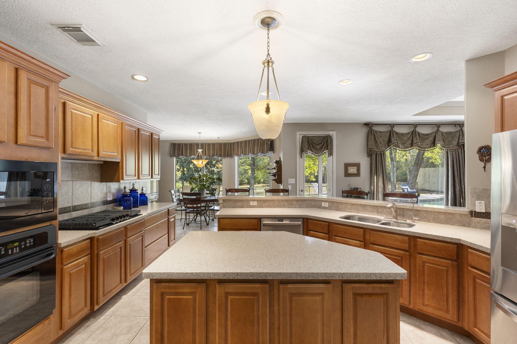 20111 Hilltop Ranch Drive Montgomery, TX 77316 - Photo 18 of 32 a kitchen with counter top space appliances and cabinets