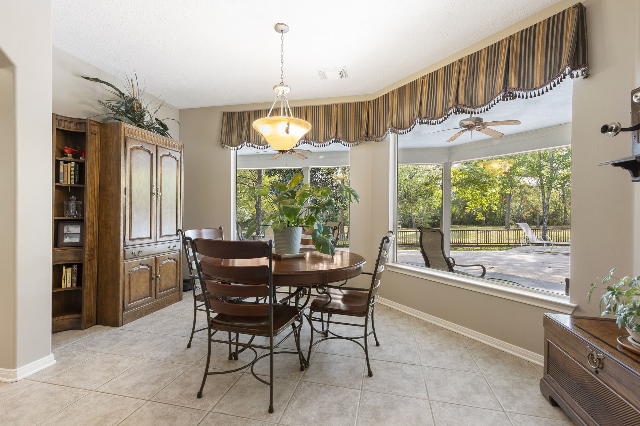 20111 Hilltop Ranch Drive Montgomery, TX 77316 - Photo 19 of 32 a view of a dining room with furniture window and wooden floor