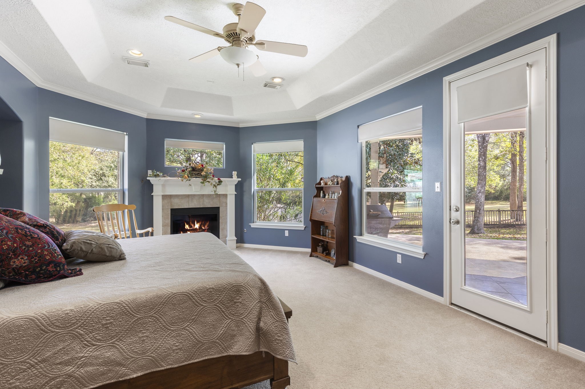 20111 Hilltop Ranch Drive Montgomery, TX 77316 - Photo 20 of 32 a bedroom with a bed and a fireplace