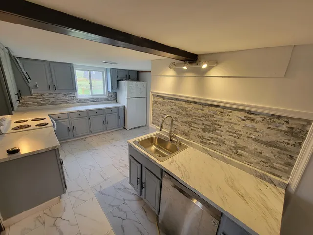 a kitchen with a stove and a sink