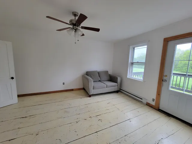 a living room with a couch and a window