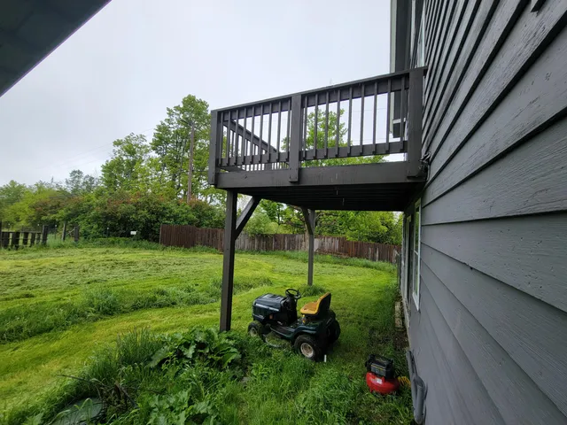 a view of a back yard from a balcony