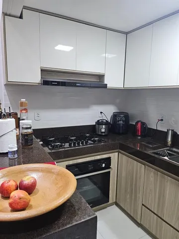 a kitchen with granite countertop a stove and a sink