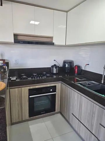 a kitchen with stainless steel appliances granite countertop a stove and cabinets