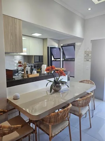 a kitchen with a refrigerator and a stove