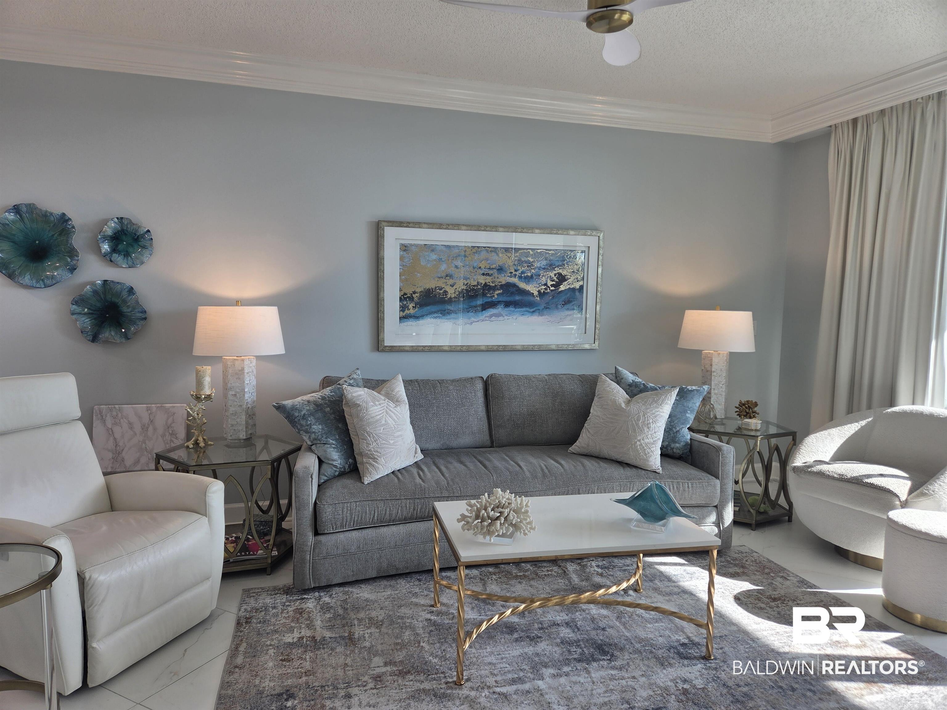 27580 Canal Road, Unit 1210 Orange Beach, AL 36561 - Photo 12 of 28 Living room featuring crown molding, a textured ceiling, and ceiling fan