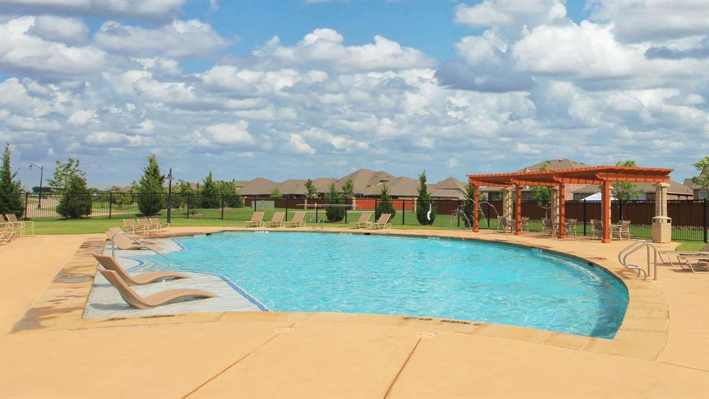 2933 Soaring Hls Drive Forney, TX 75126 - Photo 7 of 14 a view of swimming pool with outdoor seating and yard in back