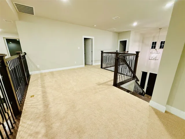 a view of entryway with wooden floor and stairs