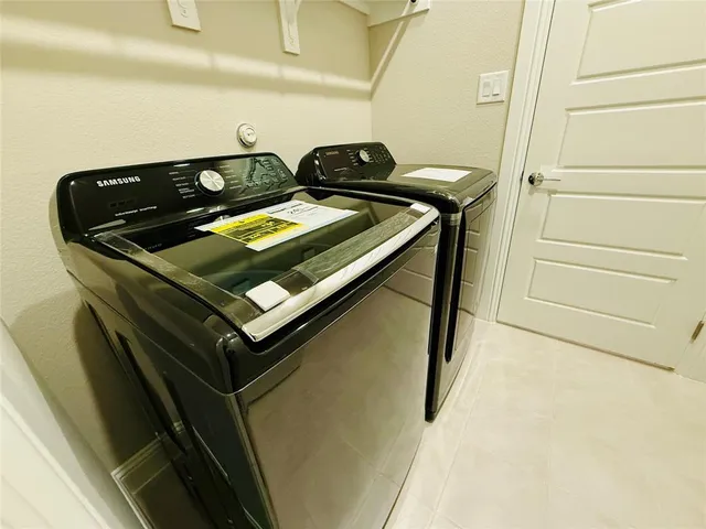 a house view with swimming pool in front of it