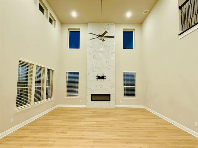 a view of a livingroom with a fireplace and wooden floor