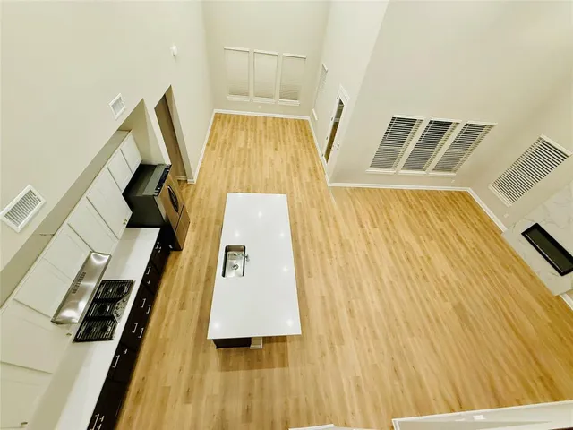 a view of stairs and wooden floor