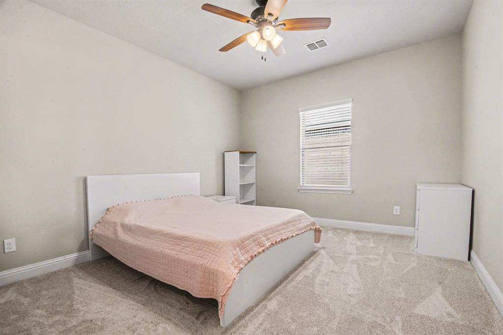 3323 Royal Ridge Drive Rockwall, TX 75087 - Photo 26 of 37 a bedroom with a bed and window
