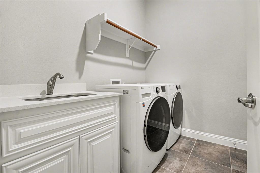 3323 Royal Ridge Drive Rockwall, TX 75087 - Photo 29 of 37 a utility room with dryer and washer